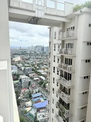 an overhead view of a city from a building at Casita avec Amour at Lumiere Residences in Manila