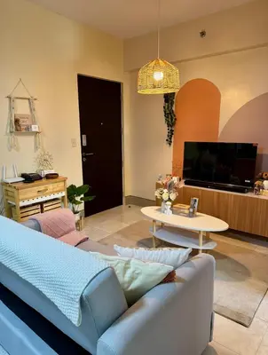 a living room with a couch and a table at Family Comfort Zone Staycation at Greenhills in Manila