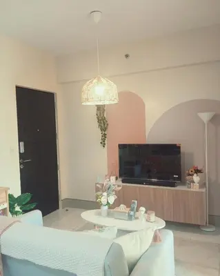 a living room with a table and a tv at Family Comfort Zone Staycation at Greenhills in Manila