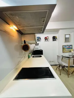 a kitchen with a sink and a counter top at Casa azure by B&M STAYCATION at Paranque in Manila