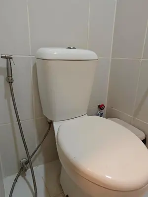 a bathroom with a white toilet in a room at Condo Unit, 2 Beds, Wi-fi, Free Amenities in Manila