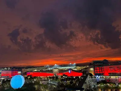 a city lit up at night with a red sky at Milk and honey condotel in Manila