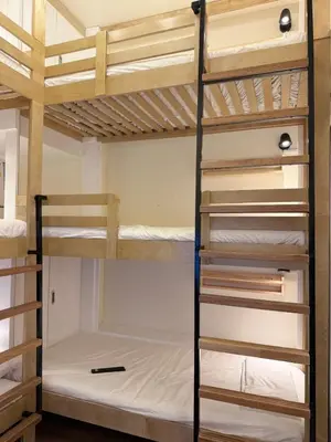a bunk bed room with a couple of bunk beds at The Camden Place Family Group Apartment Condo Unit in Manila