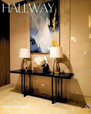 a table with two lamps on it in a lobby at Cabana Residence at Shore 3 - MOA Complex in Manila
