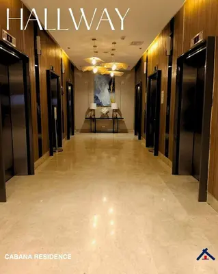 a hallway in a building with a sign that reads hall way at Cabana Residence at Shore 3 - MOA Complex in Manila