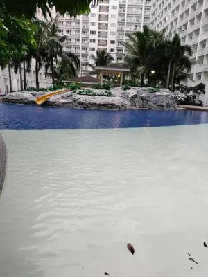 a large pool of water in a city with tall buildings at 1BR Romantic guest room at Shore Residences, Pasay Near MOA & Airport in Manila