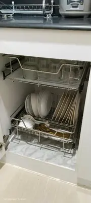 a dishwasher with plates and dishes in it at 1BR Romantic guest room at Shore Residences, Pasay Near MOA & Airport in Manila