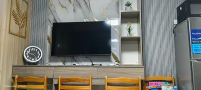 a flat screen tv sitting on top of a cabinet at 1BR Romantic guest room at Shore Residences, Pasay Near MOA & Airport in Manila