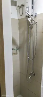 a shower in a bathroom with a shower at 1BR Amenity View Room at Shore Residences, Pasay Near MOA & Airport in Manila
