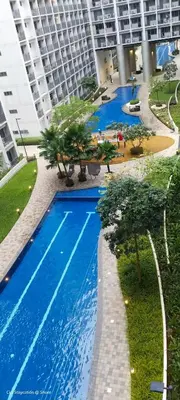 an overhead view of a swimming pool in a building at 1BR Amenity View Room at Shore Residences, Pasay Near MOA & Airport in Manila