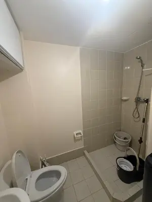 a bathroom with a toilet and a bidet at Cypress 108 in Manggahan