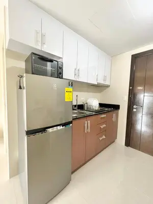 a kitchen with a refrigerator and a microwave at KIEL HOTEL - Manila Airport NAIA Terminal 3 in Manila