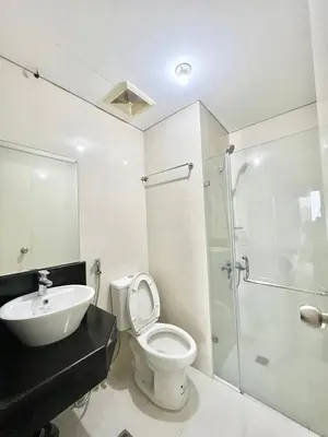 a bathroom with a toilet and a sink and a shower at KIEL HOTEL - Manila Airport NAIA Terminal 3 in Manila