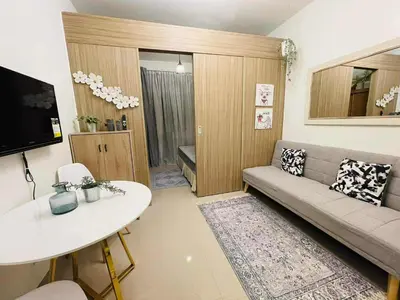a living room with a couch and a table at Jaiden & Blake Sweet Home in Manila