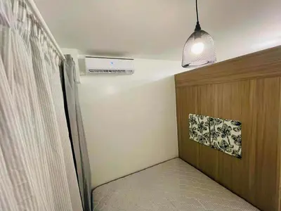 a hallway with a room with a heater and a ceiling at Jaiden & Blake Sweet Home in Manila