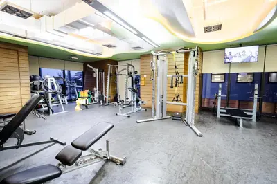a gym with several treadmills and machines at Modern Studio with Balcony at Knightsbridge Residences, Poblacion Makati in Manila
