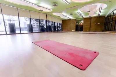 a pink yoga mat on the floor of a gym at Modern Studio with Balcony at Knightsbridge Residences, Poblacion Makati in Manila