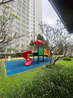 a playground in front of a large building at Jazz Tower A Cozy Room for 2 Adults in Manila