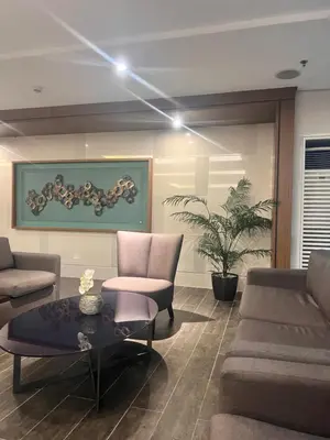 a living room with a couch and a table at Boho Cove PH in Manila