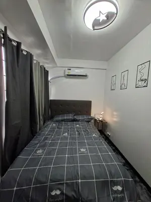 a bedroom with a bed in a room at Pod 520 in Manila
