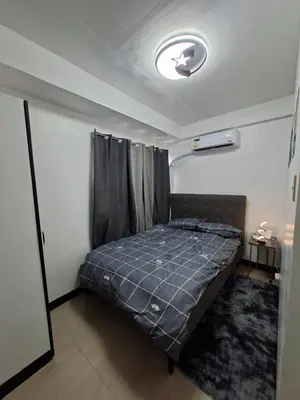 a bedroom with a bed in a room at Pod 520 in Manila