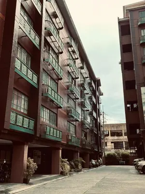 a large building with balconies on the side of it at Pod 520 in Manila