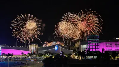 a group of fireworks in the sky over a city at MOA Staycation Condotel in Manila