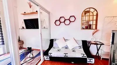 a bedroom with a bed and a mirror at Minimalist Condo near NAIA Free Netflix Pool Balcony in Manila