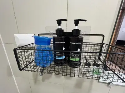 a wire rack with three bottles of water and water glasses at Modern MOA Escape, Work, Chill & City Views in Manila