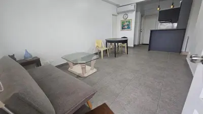 a living room with a couch and a table at Nemar Building 204 in Manila