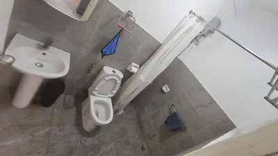 a bathroom with a toilet and a sink at Nemar Building 204 in Manila