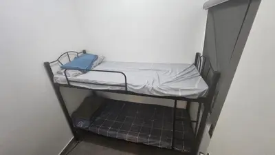 a small bunk bed in a small room at Nemar Building 204 in Manila