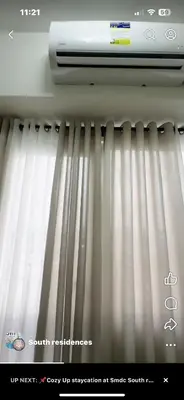 a window with white blinds in a room at SMDC South Residences in Manila