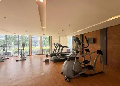 a gym with several exercise bikes in a room at Walkable to and from NAIA 3 and Resorts World in Manila