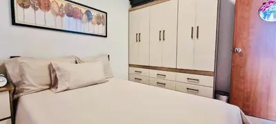 a bedroom with a white bed and a closet at The Hive Cozy 1-BR Retreat in Taytay