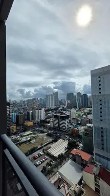 a view of a city from the balcony of a building at Urban Retreat at The Gramercy Residences Makati in Manila