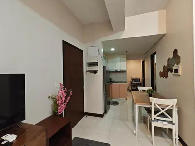 a kitchen and dining room with a refrigerator and a table at RL airport haven in Manila