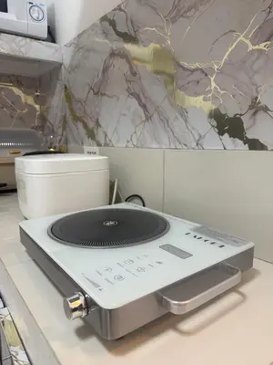a appliance sitting on a counter in a kitchen at TGG Suites at Birch Tower in Manila