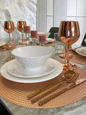 a table with a white bowl and plates and silverware at Luxury 2BR in Uptown Parksuites BGC Balcony & Prime location in Manila