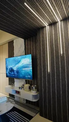 a room with a flat screen tv on a wall at Luxury 2BR in Uptown Parksuites BGC Balcony & Prime location in Manila