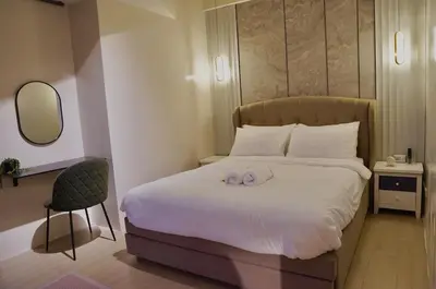 a bedroom with a bed with a towel on it at Luxury 2BR in Uptown Parksuites BGC Balcony & Prime location in Manila