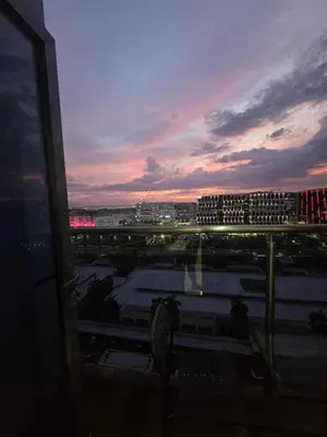 a view from a window of a city at sunset at City Escape Haven in Manila