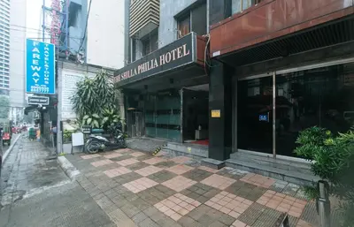 a building with a sign on the front of it at The Shilla Philia Hotel by RedDoorz in Manila
