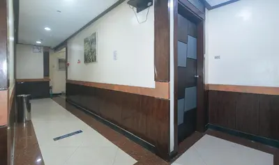 a hallway with a door in a building at The Shilla Philia Hotel by RedDoorz in Manila
