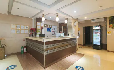 a restaurant with a counter in a lobby at The Shilla Philia Hotel by RedDoorz in Manila