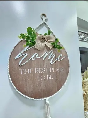 a wooden sign that saysarma the best place to be at New Crib at Shore 3 in Manila
