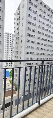 a view of a large white building from a balcony at Stand out and cozy condo unit at Shore 2 Tower 3 in Manila