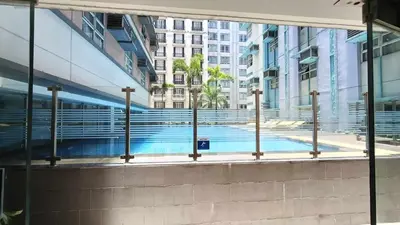 a view of a swimming pool from a building at Manila Airport Hub near NAIA T3 -101 Newport Boulevard in Manila