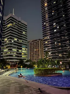 a swimming pool in a city with tall buildings at The Urban Crib SMDC Residences Makati in Manila