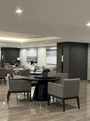 a conference room with a table and chairs and people at The Urban Crib SMDC Residences Makati in Manila